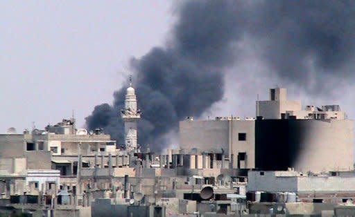 A picture released by the Syrian opposition Shaam News Network allegedly shows an explosion in the al-Safsafa district of Homs. AFP is using images from alternative sources. Shells have rained down on rebel positions in Aleppo ahead of a UN vote to deplore both the Syrian regime's use of heavy arms and world powers for failing to agree on steps to end the conflict
