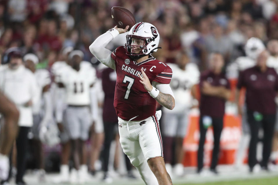 South Carolina quarterback Spencer Rattler (7) rolls out to pass during the first half of an NCAA college football game against Mississippi State on Saturday, Sept. 23, 2023, in Columbia, S.C. (AP Photo/Artie Walker Jr.)