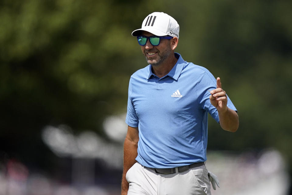 Sergio Garcia, of Spain, waves to the crowd in celebration after he made an eagle on the first hole during the first round of the Tour Championship golf tournament, Thursday, Sept. 2, 2021, at East Lake Golf Club in Atlanta. (AP Photo/Brynn Anderson)