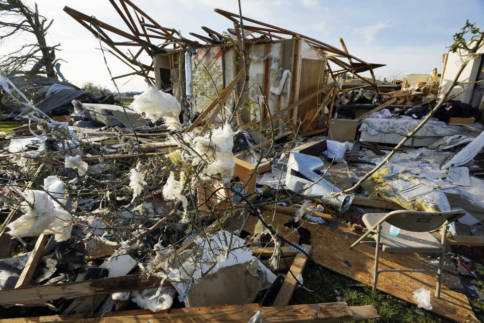 Debris is what remains from a house destroyed by the Friday night tornado in Rolling Folk, Miss., on Sunday morning, March 26, 2023. The area is quiet after families, friends and neighbors spent most of Saturday trying to salvage their possessions. The tornado was part of a system of severe weather that moved through several southern states causing death and destruction. (AP Photo/Rogelio V. Solis)