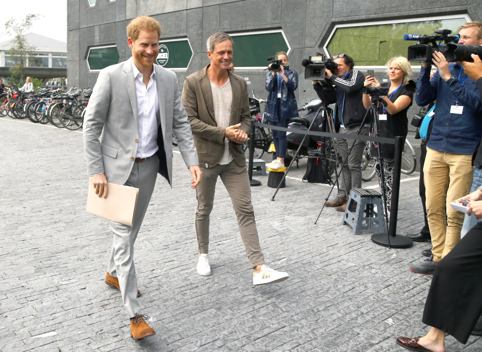 Sander Groet (right), a partner at the A'DAM Tower in Amsterdam greets the Duke of Sussex as he arrives for the launch of a new travel industry partnership. (Photo by Gareth Fuller/PA Images via Getty Images)