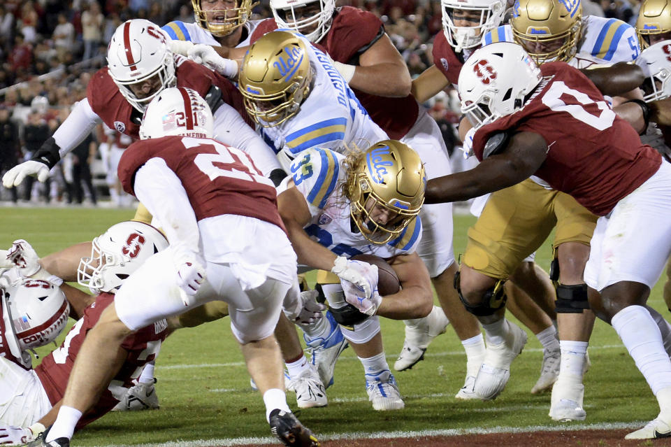 UCLA running back Carson Steele (33) scores a touchdown during an NCAA college football game against Stanford, Saturday, Oct. 21, 2023, in Stanford, Calif. (AP Photo/Scot Tucker)