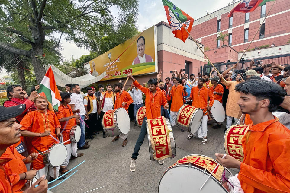 A band plays music as Bharatiya Janata Party (BJP) supporters dance inside the party office after hearing of a candidate's victory during the counting in India's national election, in New Delhi, India, Tuesday, June 4, 2024. xPrime Minister Narendra Modi's Hindu nationalist party showed a comfortable lead Tuesday, according to early figures reported by India's Election Commission, but was facing a stronger challenge from the opposition than had been expected. (AP Photo/Manish Swarup)