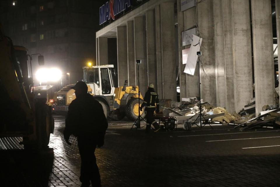 Emergency service unit personnel work at the collapsed Maxima supermarket in Riga