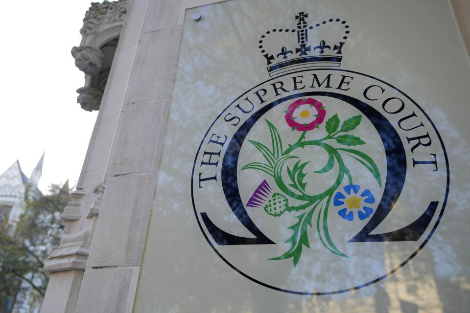 A view of the entrance of the Supreme Court in London, Wednesday, Nov. 15, 2023. Britain's highest court is set to rule Wednesday, Nov. 15 on whether the government's plan to send asylum-seekers to Rwanda is legal, delivering a boost or a blow to a contentious central policy of Prime Minister Rishi Sunak's administration. Five justices on the U.K. Supreme Court will deliver judgment in the government's attempt to overturn a lower court ruling that blocked deportations. (AP Photo/Kirsty Wigglesworth)