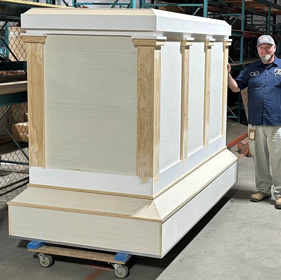 Carpenter Ed Humphries with Chesterfield County General Services stands by the Tomb of the Unknown Soldier replica he built for the 2023 Memorial Day ceremony.