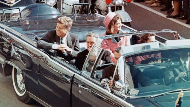 PHOTO: President John F Kennedy, First Lady Jacqueline Kennedy, Texas Governor John Connally, and others smile at the crowds lining their motorcade route in Dallas, Nov. 22, 1963. (Bettmann Archive/Getty Images)