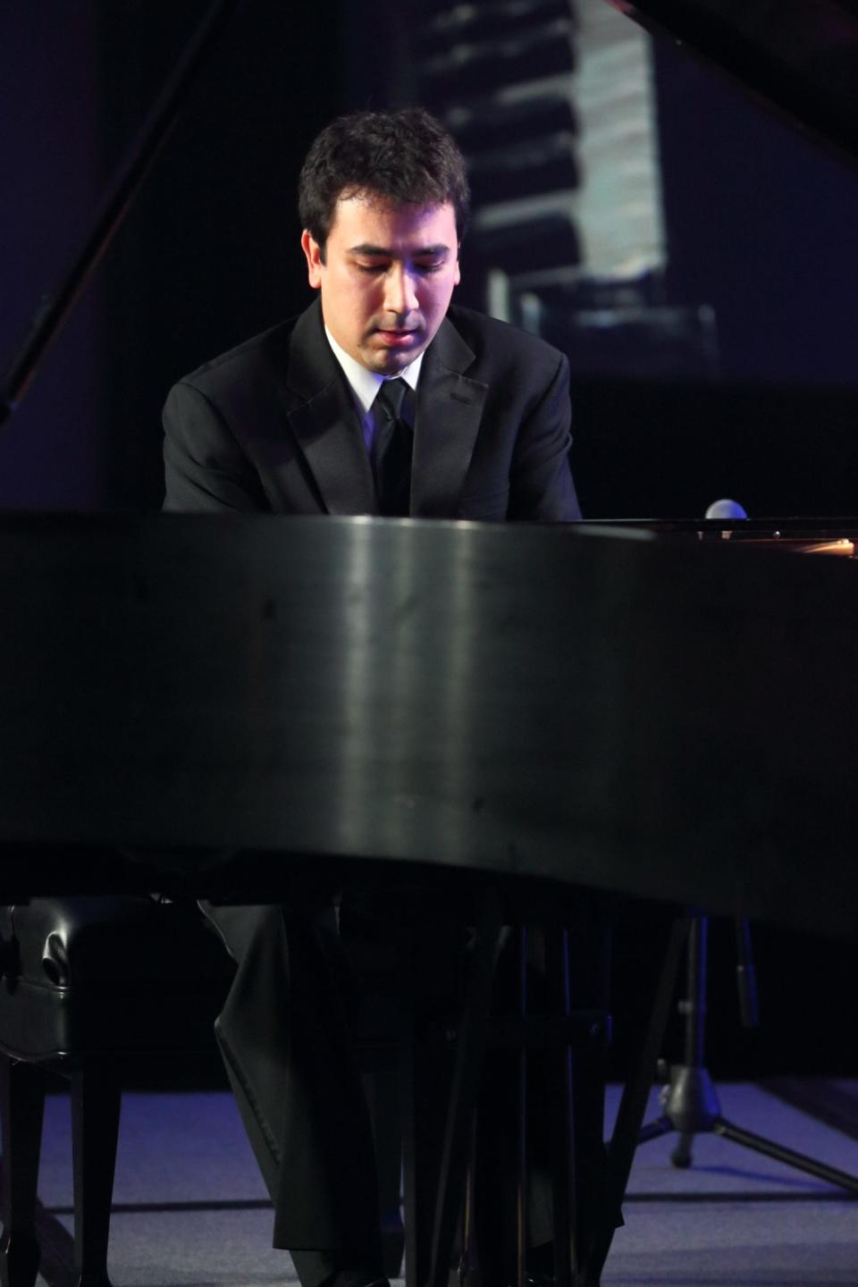 Scott Cuellar competes at a piano competition around 2013. Today, Cuellar is an assistant professor of applied music and performance (piano) at the Syracuse University Setnor School of Music.