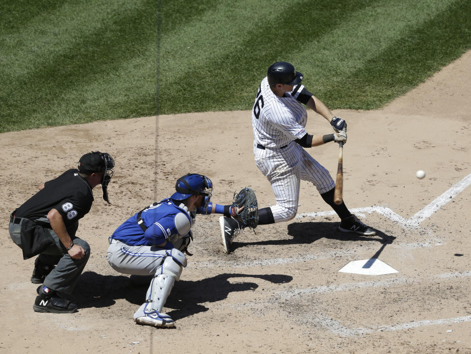 New York Yankees' DJ LeMahieu hits a two-run home run during the fourth inning of a baseball game against the Toronto Blue Jays at Yankee Stadium, Wednesday, June 26, 2019, in New York. (AP Photo/Seth Wenig)