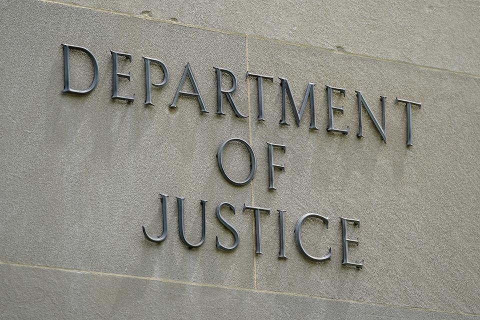 An exterior sign is photographed outside the Robert F. Kennedy Department of Justice building in Washington on May 4, 2021.