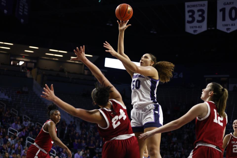 Kansas State center Ayoka Lee (50) shoots over Oklahoma's Skylar Vann (24) during their Jan. 10 game at Bramlage Coliseum. Lee suffered an ankle injury in the game that will sideline her for about four weeks.