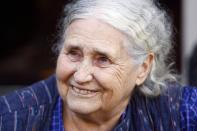 British novelist Doris Lessing smiles on the doorstep of her house in London in this October 11, 2007, file photo. The Nobel Prize-winning novelist Doris Lessing, one of the most important English-language writers of the late 20th century, has died aged 94, her publisher said on November 17, 2013. REUTERS/Kieran Doherty (BRITAIN - Tags: SOCIETY PROFILE ENTERTAINMENT OBITUARY)