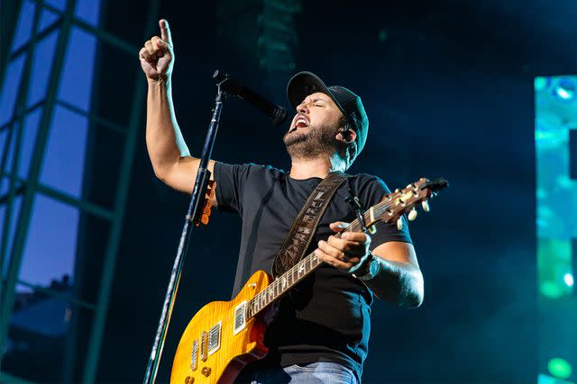 <p>Mathew Tsang/Getty</p> Luke Bryan performing during the Country On tour in June.