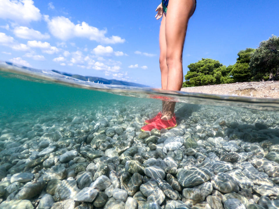 Young Adult Woman Chilling Feets at the Beach.