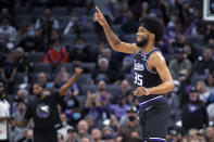 Sacramento Kings forward Marvin Bagley III reacts after scoring a 3-point basket during the first quarter of the team's NBA basketball game against the Orlando Magic in Sacramento, Calif., Wednesday, Dec. 8, 2021. (AP Photo/Jose Luis villegas)