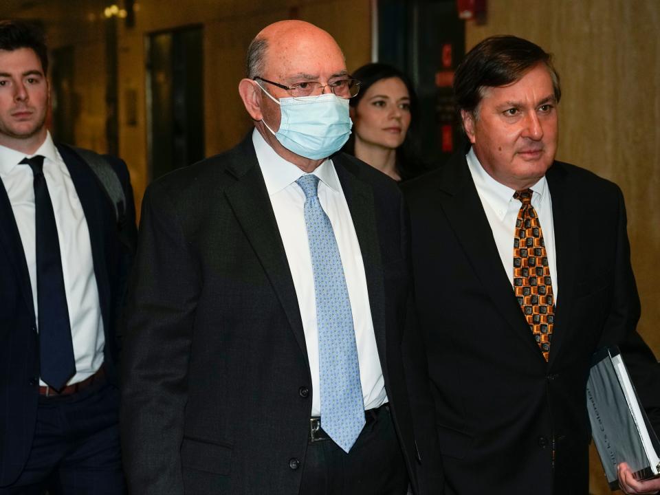 The Trump Organization's former chief financial officer, Allen Weisselberg, arrives at the company's Manhattan tax-fraud trial with his attorney, Nicholas Gravante, Jr., on November 15, 2022.