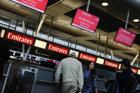 Travelers wait at an Emirates Airlines ticket desk at JFK International Airport in New York, U.S., March 21, 2017. REUTERS/Lucas Jackson