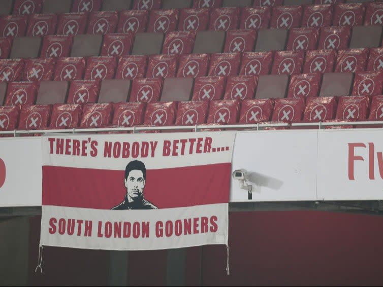 <p>A banner is displayed at the empty Emirates in support of Mikel Arteta</p>Arsenal FC via Getty Images