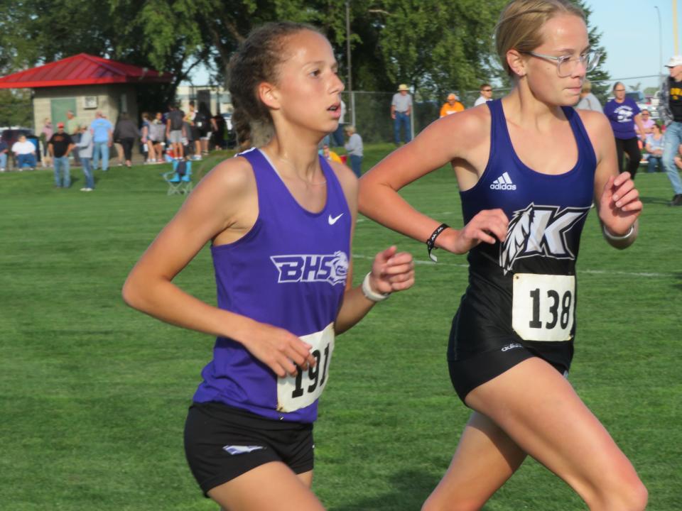 Burlington's Mylee Stiefel (left) and Keokuk's Rylee Olsen compete in the Tony Proctor Invitational Thursday at the Burlington Regional RecPlex.