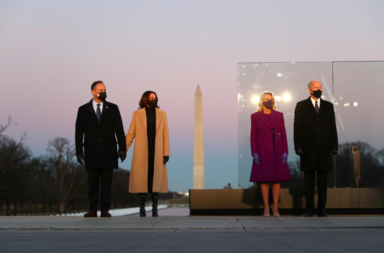 President-elect Joe Biden, his wife Jill Biden, Vice President-elect Kamala Harris and her husband Doug Emhoff attend a coronavirus memorial event at the Lincoln Memorial in Washington, January 19, 2021. (Tom Brenner/Reuters)