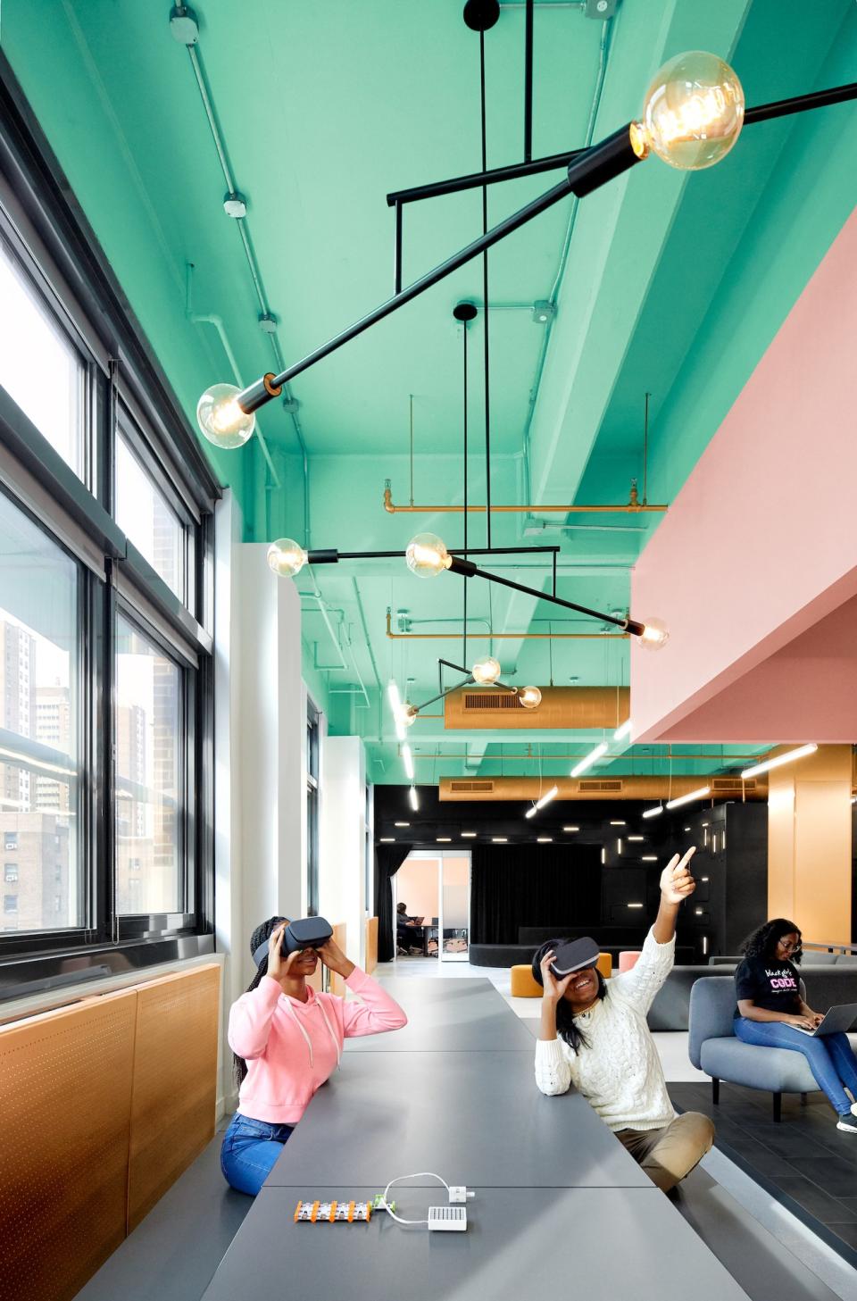 The space was designed with brightly colored walls that encourage the girls to interact with it.