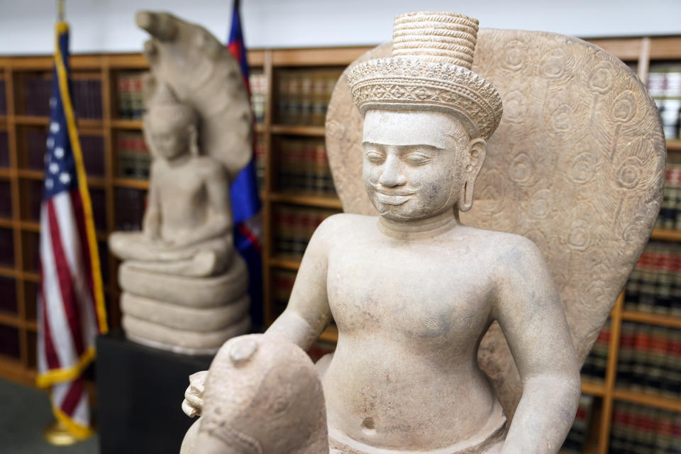 Some of the Cambodian antiquities recovered by the United States Attorney's Office are displayed during a news conference in New York, Monday, Aug. 8, 2022. Officials were announcing the repatriation of 30 antiquities to Cambodia that had been illegally trafficked. (AP Photo/Seth Wenig)