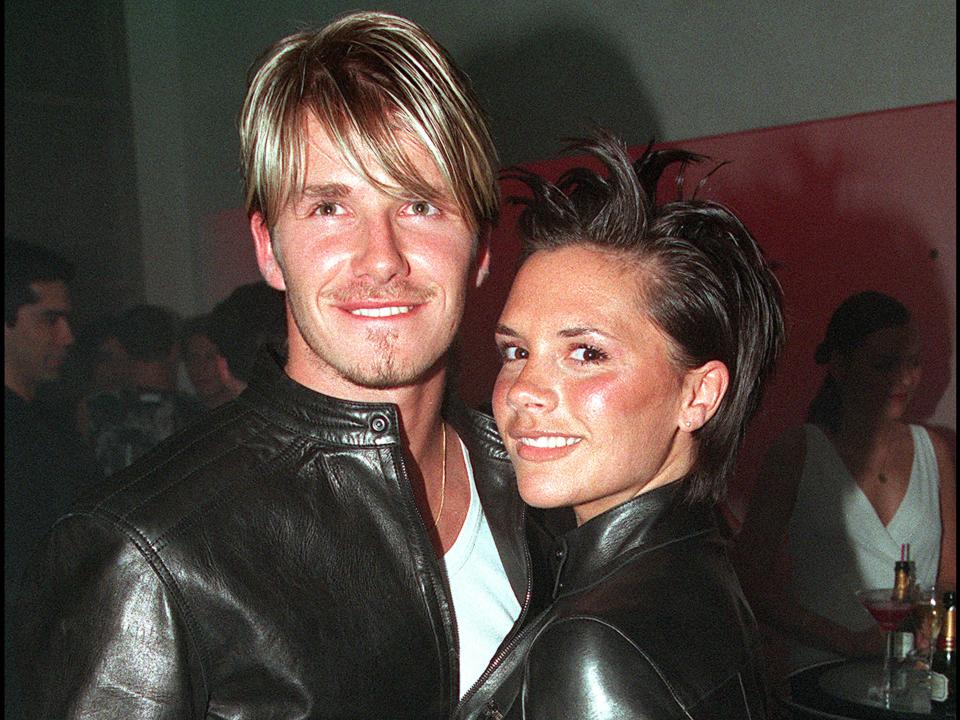 David and Victoria Beckham wearing matching outfits in 1999