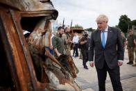British Prime Minister Boris Johnson and Ukraine's President Volodymyr Zelenskiy visit an exhibition of destroyed Russian military vehicles and weaponry in Kyiv