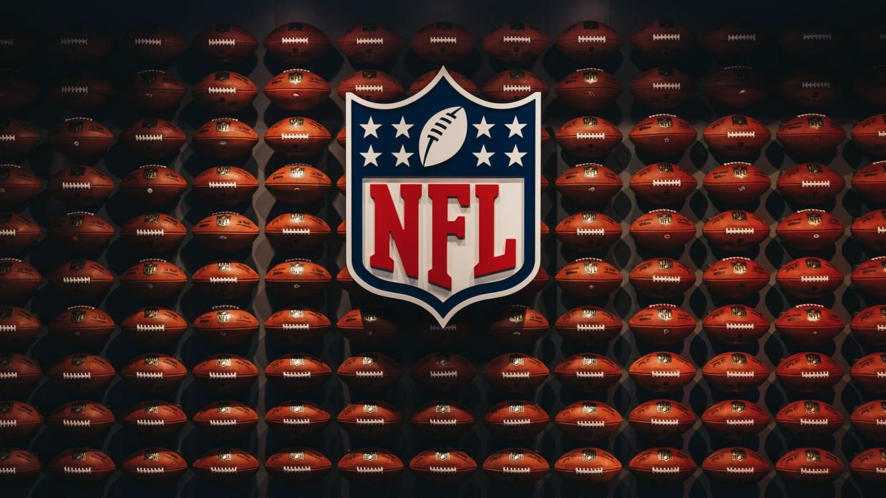 NEW YORK, USA - MAY 28, 2018: Rows of american football balls in NFL Experience in Times Square, New York, a first-of-its-kind live action attraction, combining interactive games and 4D theatre.