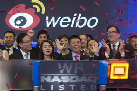 Weibo Corporation Chairman Charles Chao rings the opening bell at the NASDAQ MarketSite in Times Square in celebration of Weibo's initial public offering (IPO) on The NASDAQ Stock Market in New York April 17, 2014. REUTERS/Andrew Kelly