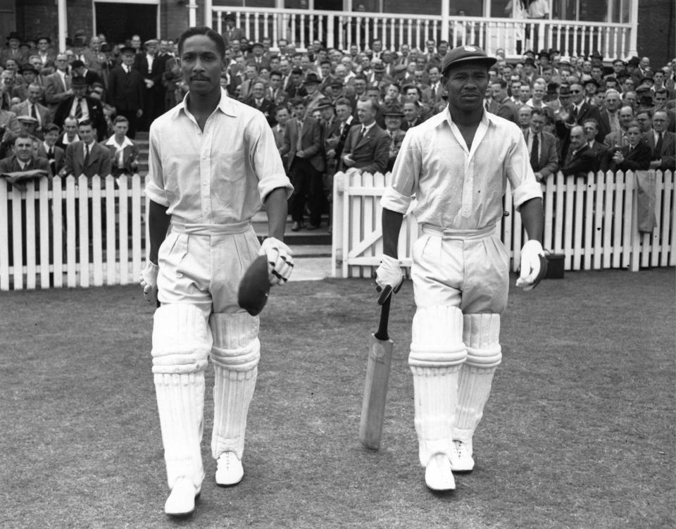 Frank Worrell, left, and Weekes walk out at Trent Bridge in 1950 to resume their partnership, which reached 283  - Central Press/Getty Images