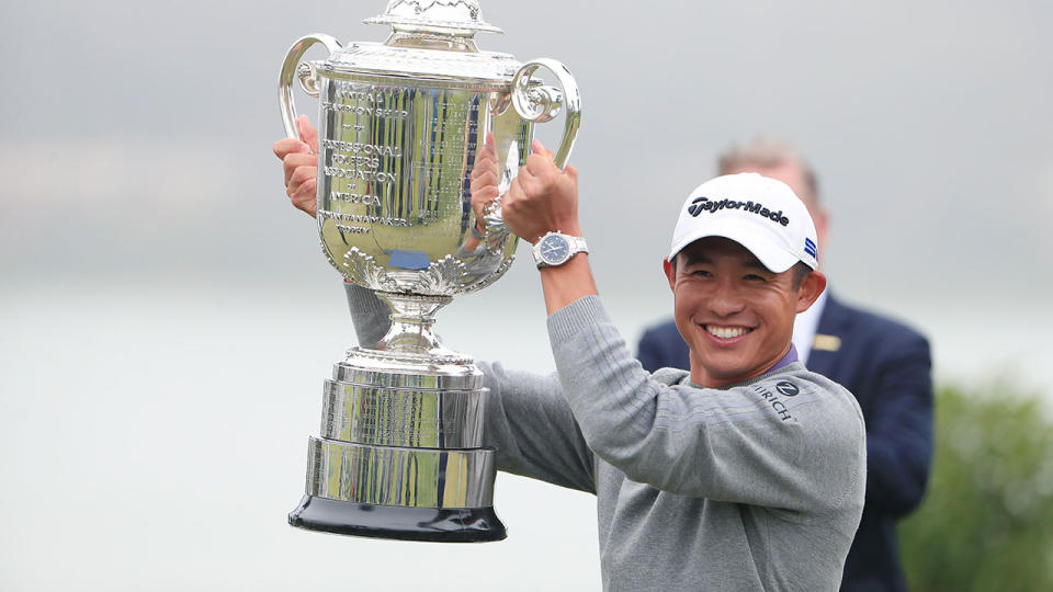 Pictured here, Collin Morikawa hoists the PGA Championship trophy aloft.