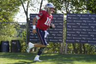 New England Patriots quarterback Mac Jones steps on the field at the start of an NFL football joint practice with the Carolina Panthers, Tuesday, Aug. 16, 2022, in Foxborough, Mass. (AP Photo/Steven Senne)