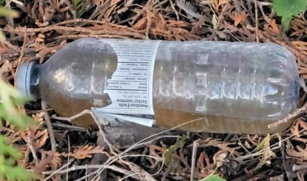 Another bottle found near Moore's home in Harrow is shown here.