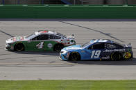 Kevin Harvick (4) and Martin Truex Jr. (19) run during a NASCAR Cup Series auto race Sunday, July 12, 2020, in Sparta, Ky. (AP Photo/Mark Humphrey)