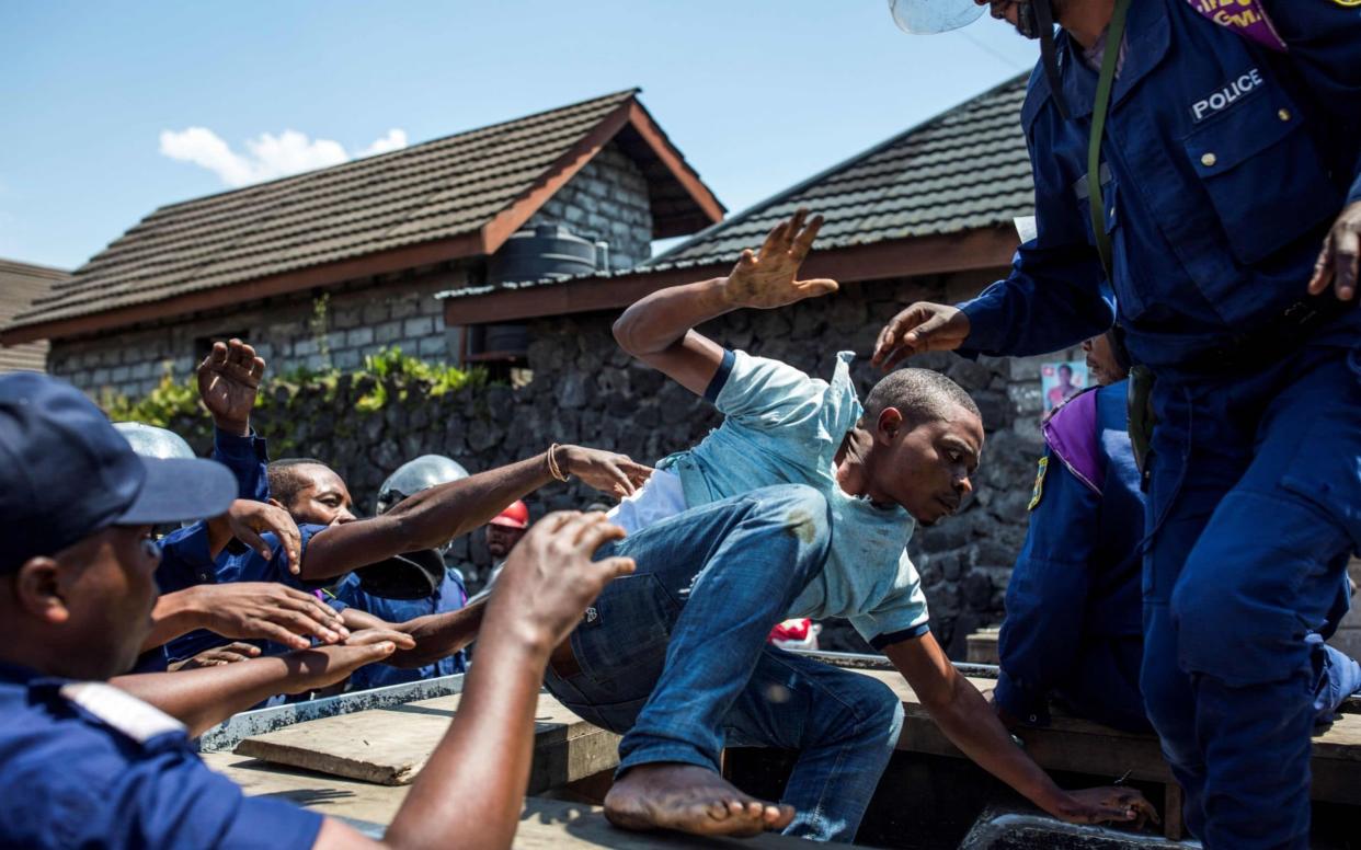 Security forces fired live rounds and teargas to disperse demonstrators who burned tires in and around Beni - AFP