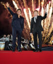 <p>Tom Cruise and Jerry Bruckheimer wave to fans on the red carpet at the Japan premiere of <em>Top Gun: Maverick</em> on May 23 at Osanbashi Yokohama.</p>