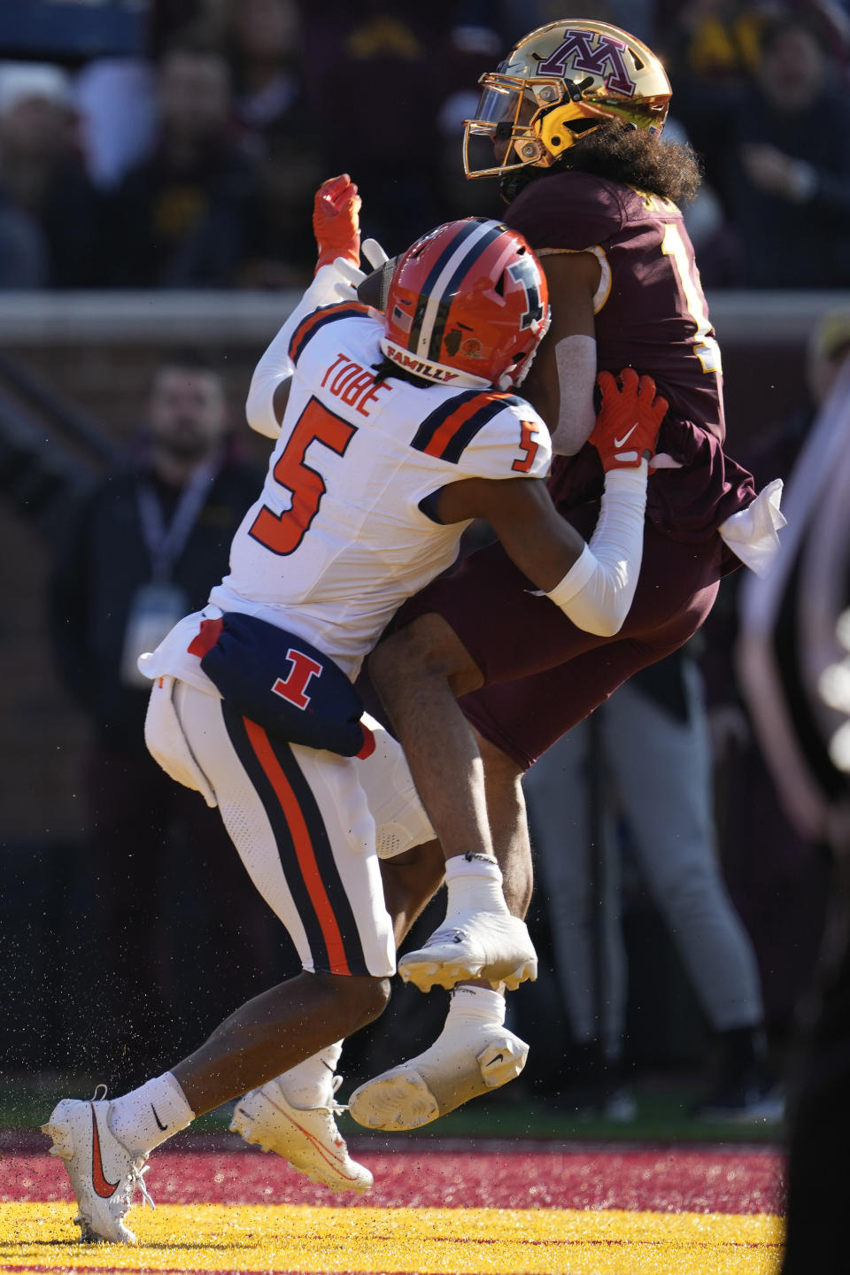 Minnesota wide receiver Elijah Spencer, top, catches a pass against Illinois defensive back Zachary Tobe (5) to score a 15-yard touchdown during the first half of an NCAA college football game Saturday, Nov. 4, 2023, in Minneapolis. (AP Photo/Abbie Parr)