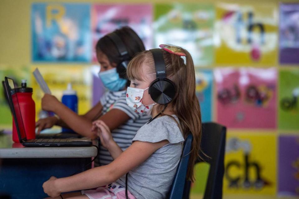 Students are masked up while they do lessons on their computers in a first grade summer school classroom at Phillis Wheatley Elementary School in Kansas City. With the start of the school year a month away, Kansas City area districts are deciding on masks and vaccine rules as COVID-19 cases surge.