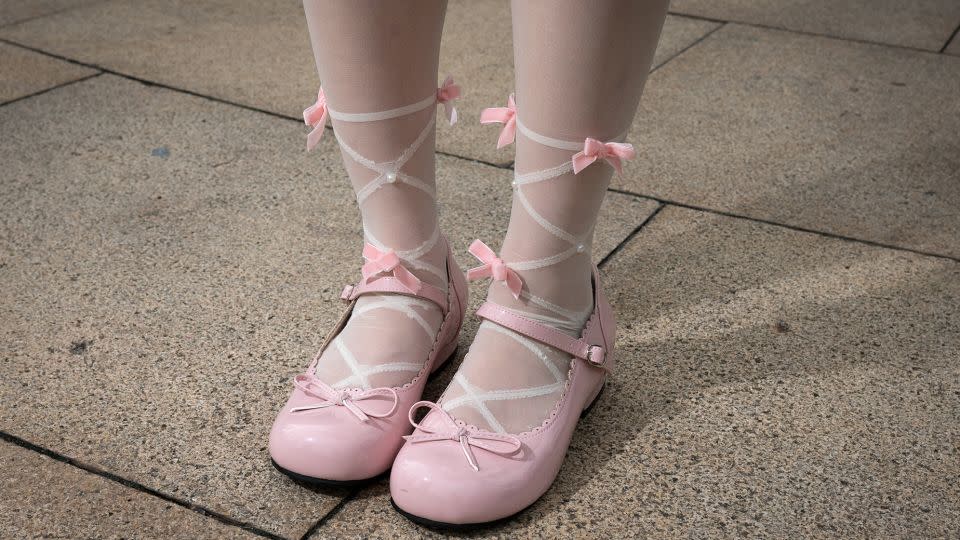 Liang has paid attention to detail, donning ballerina-like tights and baby pink Mary Janes. - Noemi Cassanelli/CNN