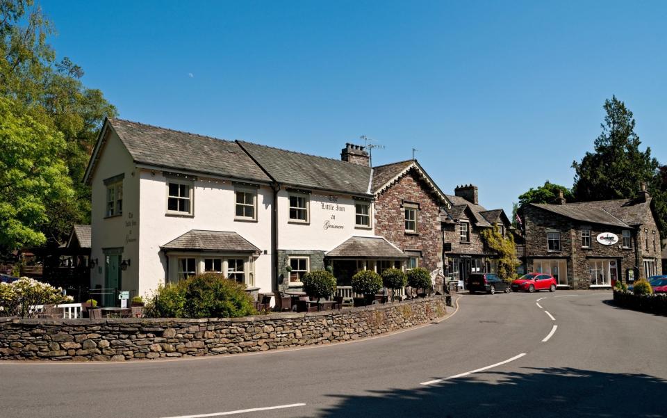 Shops and restaurants in the village in spring Grasmere Cumbria England