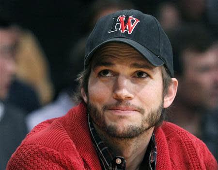 Actor Ashton Kutcher sits courtside at the Los Angeles Lakers against Denver Nuggets NBA Western Conference quarter-final basketball playoff game in Los Angeles, California in this file photo taken May 1, 2012. REUTERS/Alex Gallardo/Files