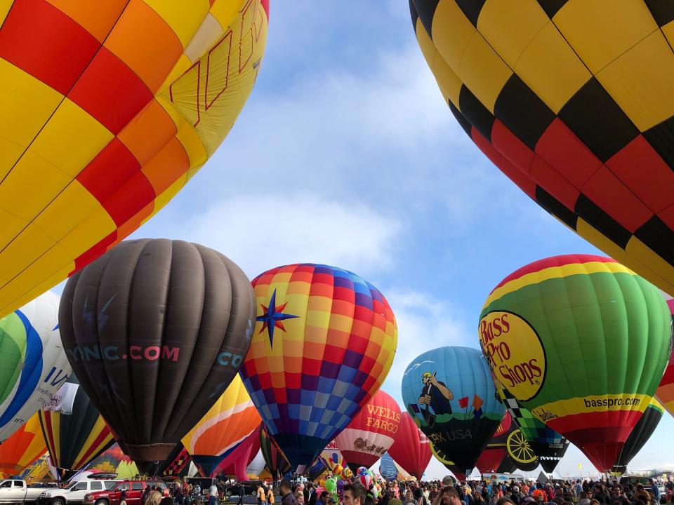 Hot air balloons are inflated during the annual Albuquerque International Balloon Fiesta in Albuquerque, N.M., on Saturday, Oct. 5, 2019. Organizers are expecting tens of thousands of spectators for opening weekend and exponentially more over the course of the nine-day event. (AP Photo/Susan Montoya Bryan)