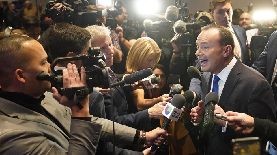 Utah Republican Sen. Mike Lee, right, speaks to reporters during an election night party Tuesday, Nov. 8, 2022, in Salt Lake City. (AP Photo/Rick Bowmer)