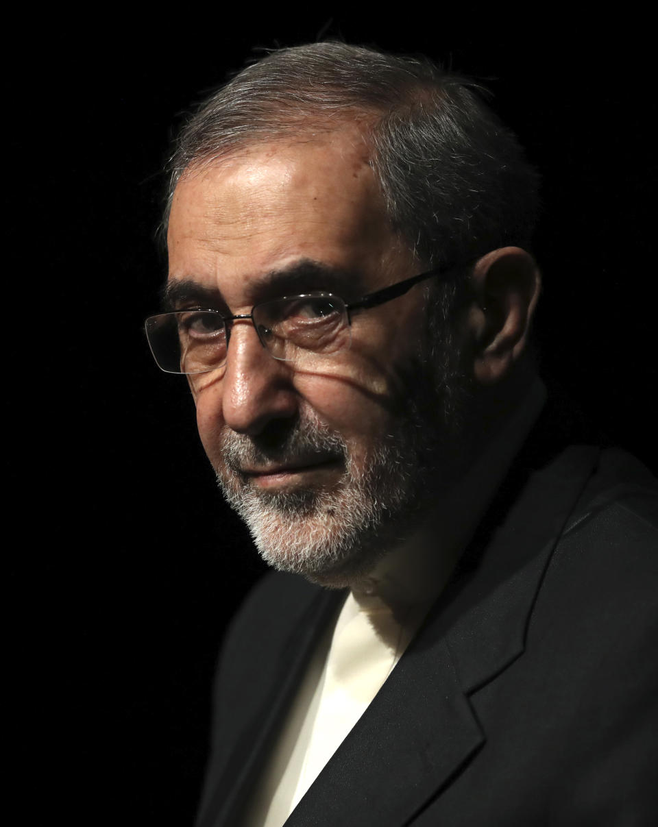 In this Jan. 30, 2020, photo, Ali Akbar Velayati, adviser to the Iranian supreme leader Ayatollah Ali Khamenei, gives a press conference, in Tehran, Iran. In hard-hit Iran, state-run TV announced that Velayati was quarantined at home after testing positive for the virus. He is a close, trusted adviser to the 80-year-old leader of the Islamic Republic, who was recently seen wearing disposable gloves at a tree-planting ceremony, apparently out of caution about the virus. (AP Photo/Vahid Salemi)