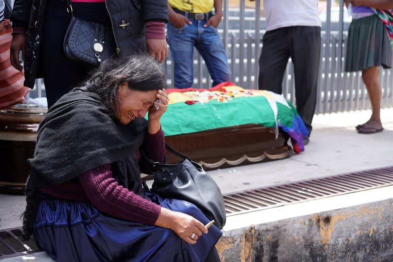 A woman reacts near the coffin of a supporter of former Bolivian President Morales in Cochabamba