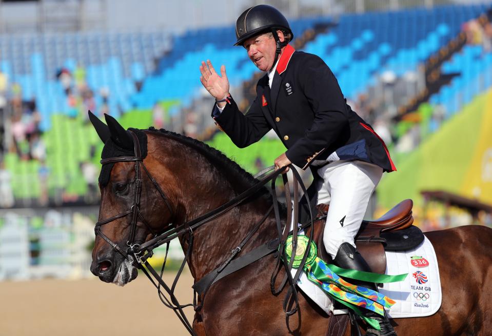 Nick Skelton celebrates his Rio Olympics gold medal triumph on Big Star (Owen Humphreys/PA) (PA Archive)