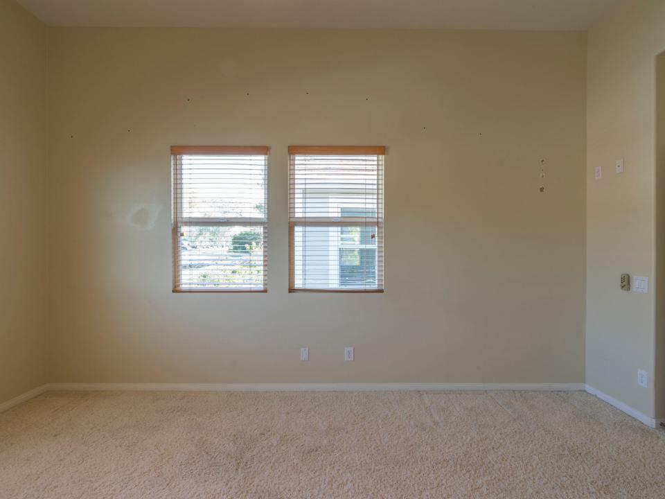 An empty room with windows.