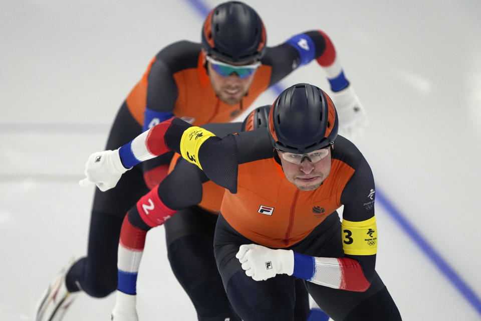 Team Netherlands, led by Sven Kramer, with Marcel Bosker center and Patrick Roest, competes during the speedskating men's team pursuit semifinals at the 2022 Winter Olympics, Tuesday, Feb. 15, 2022, in Beijing. (AP Photo/Ashley Landis)