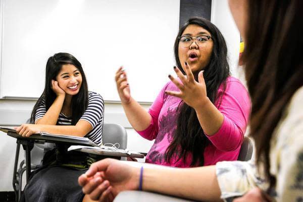 Kyla Artigo, 20, center, speaks during an Asian American studies class at Cal State Long Beach.